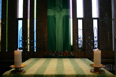 Altar with green altar cloth and "wheatsheaf cross" green banner